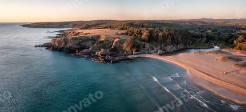 Preview: Morning view with picturesque cliffs and empty sandy beach