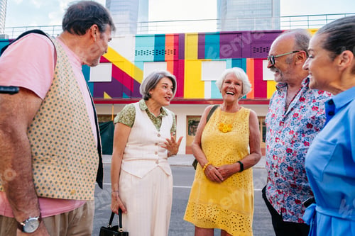 Preview: Group of senior friends meeting outddors in the city and having fun