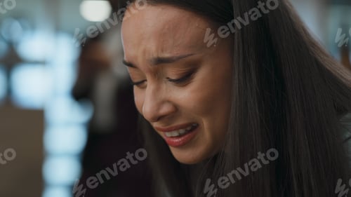 Preview: Distressed office woman crying sitting sofa closeup. Professional feeling sad