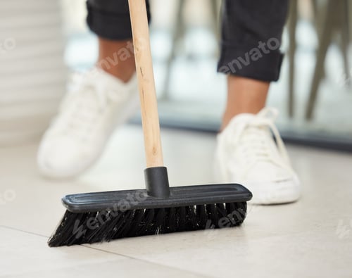 Preview: Breaking in the new broom. Cropped shot of an unrecognizable woman using a broom to sweep her home.