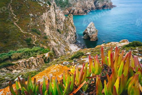 Preview: Cabo da Roca is the extreme point of Europe. Hidden beache with Rock, blue clear waters and foliage