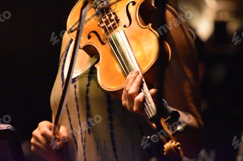 Preview: Woman in neutral colors playing a violin