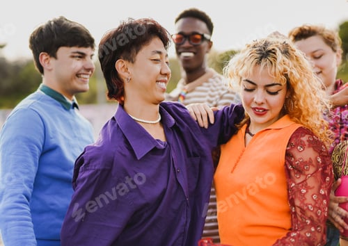 Preview: Group of young multiracial people having fun dancing together at music concert