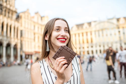 Preview: Woman with chocolate outdoors in Brussels