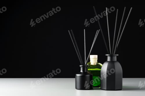 Preview: Two Black Reed Diffuser Bottles on a White Surface With Grey Background