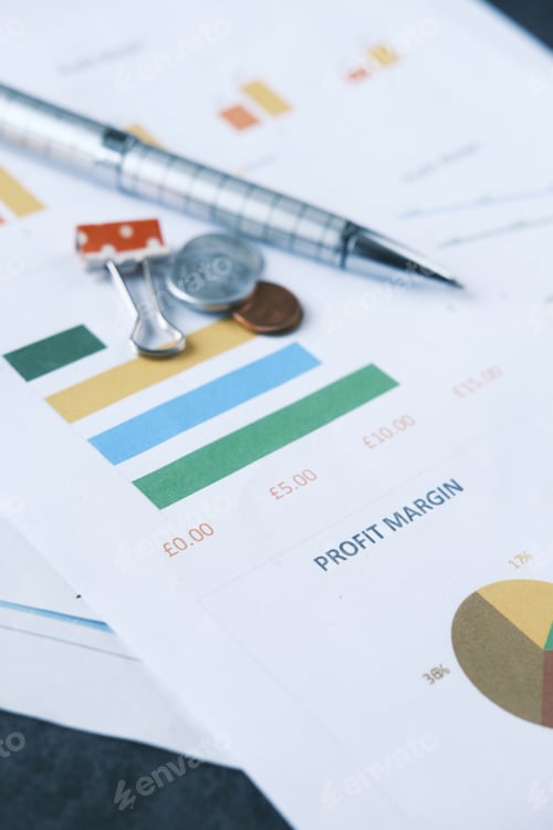 Preview: Financial Analysis Chart with Pen and Coins
