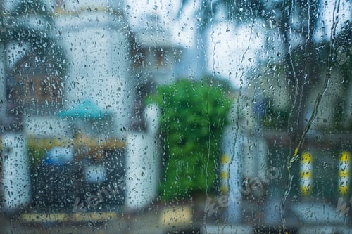 Preview: Raindrops on glass mirror background. water drop on a window