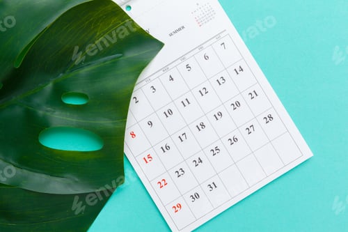 Preview: Top view flat lay of workspace desk styled design office supplies with calendar