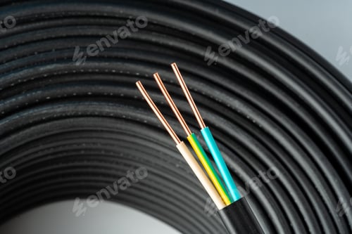 Preview: Close Up Of Black Electrical Wire Coil With Blue And White Wires