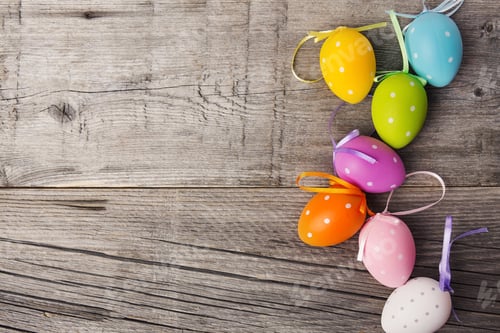 Preview: Cute small colorful eggs on wooden