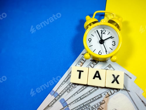 Preview: Clock and dollar banknotes with word TAX on blue and yellow background.Business concept.