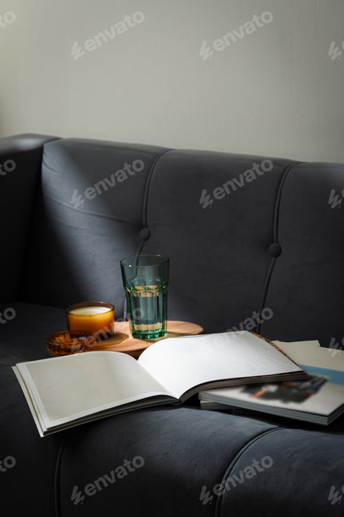 Preview: Amber Glass Candle Jar and Magazine on the couch