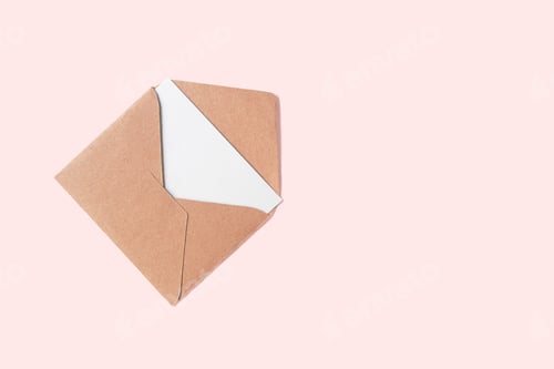 Preview: Craft paper envelope with white blank letter isolated on pink