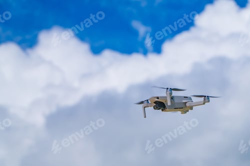 Preview: White drone flying on cloudy sky in siargao island, philippines