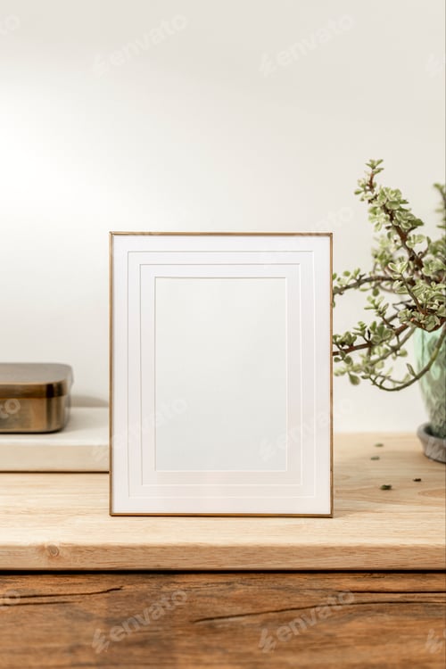 Preview: Blank decorative picture frame on wooden table