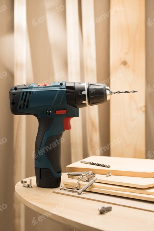Preview: Cordless Drill and Wood on a Round Table