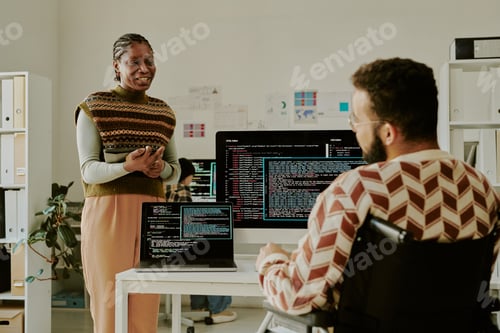 Preview: Female Programmer Chatting with Coworker