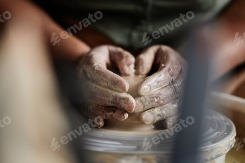 Preview: Hands Shaping Clay in Pottery Studio
