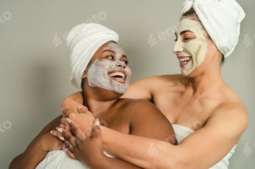 Preview: Happy multiracial women with different age and body size having skin care spa day