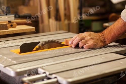 Preview: Experienced senior carpenter working in his vintage workshop.