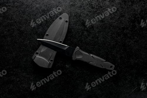 Preview: Closeup shot of a fixed sharp knife on a black background