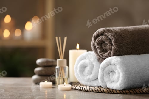 Preview: Beautiful composition with spa stones on grey marble table, closeup