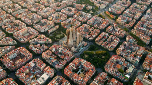 Preview: Aerial view of Barcelona city skyline and Sagrada Familia Cathedral. Eixample residential grid