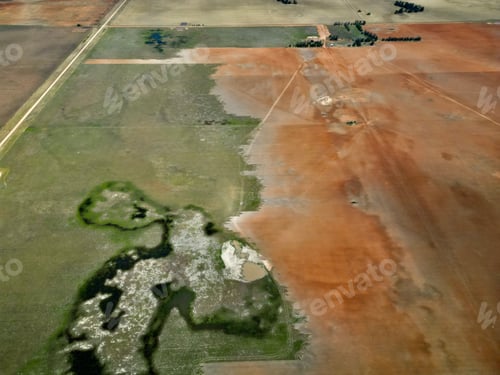 Preview: Aerial view of a tractor plowing the cultivated farmland