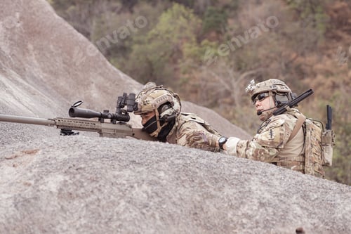 Preview: Soldiers in camouflage military uniforms carrying weapons Reconnaissance missions in rugged mountain