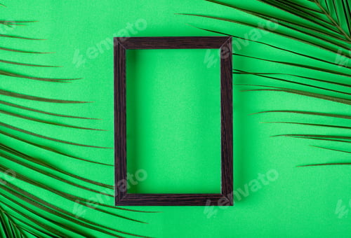 Preview: Green background with picture frame and palm leaves