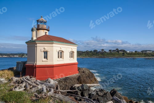 Preview: Historic Coquille River Lighthouse in Bandon, Oregon, on a rocky shore
