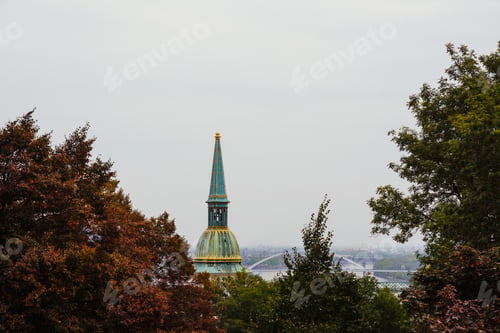 Preview: Bratislava sky line, View of St Michael's tower, among autumnal trees.