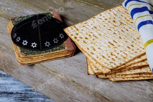Preview: Matzoh for jewish holiday Passover pesah on wooden background. View from above