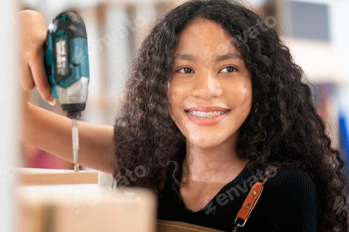 Preview: Carpenter working on the woodworking desk and furniture handmade with wood