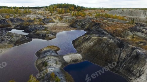 Preview: Small lake, top view. Footage. A small lake in a mountainous area. Panoramic view over the rocky