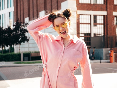 Preview: Young beautiful hipster girl posing outdoors