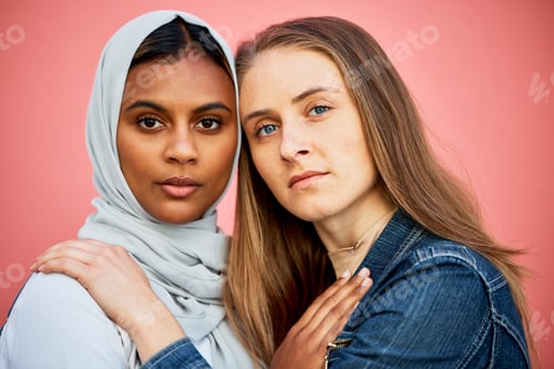 Preview: Portrait, hug and lesbian couple with relationship freedom isolated on a pink background in a studi
