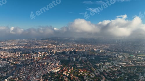 Preview: Aerial view of Barcelona City skyline above the clouds and fog, Catalonia, Spain