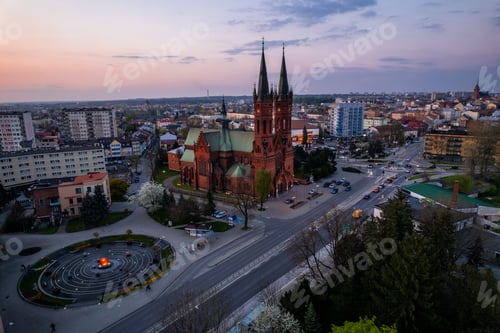 Preview: Holy Family Cathedral Church in Tarnow, Poland. Skyline of City Illuminated at Dusk.