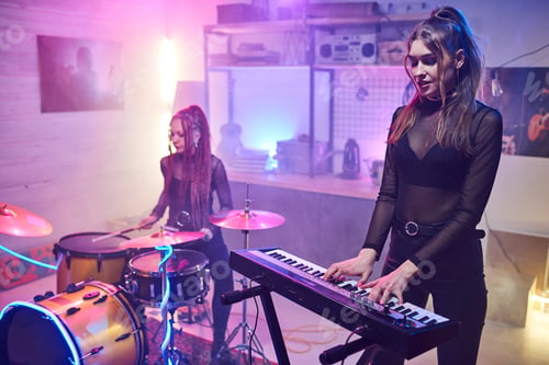 Preview: Two girls playing musical instruments in studio