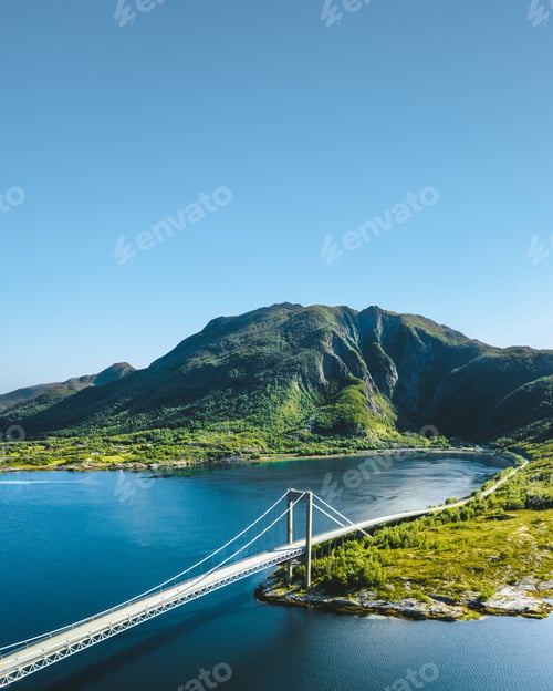 Preview: Beautiful view of a bridge over the lake surrounded by mountains in Norway
