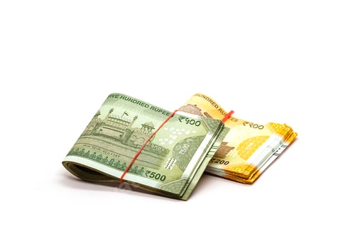 Preview: Closeup shot of 200 and 500 Indian rupees isolated on a white background