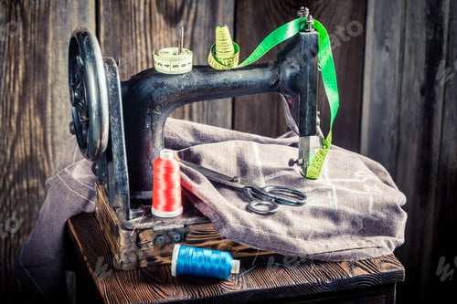 Preview: Sewing machine with scissors, colorful threads and cloth