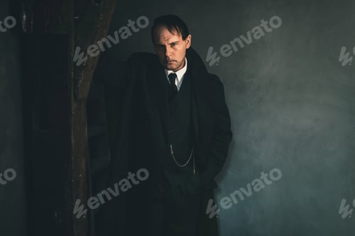 Preview: Retro 1920S English Gangster Standing Against Wooden Pole. Peaky Blinders Style.
