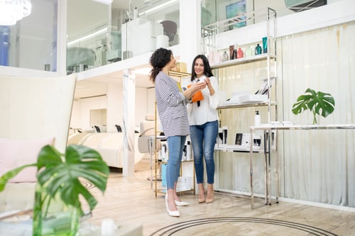 Preview: Two dark-haired women talking in the beauty shop