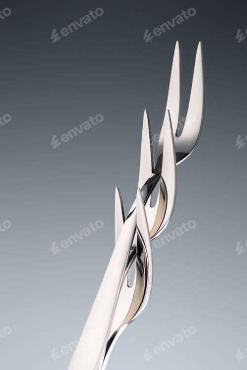 Preview: three forks with two tines isolated on grey