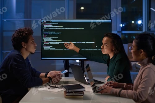 Preview: Young IT Specialists Having Meeting In Evening