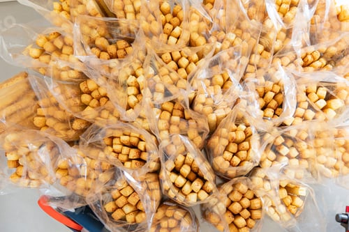 Preview: Bread sticks top view packed and ready to be delivered.Concept of artisanal bakery