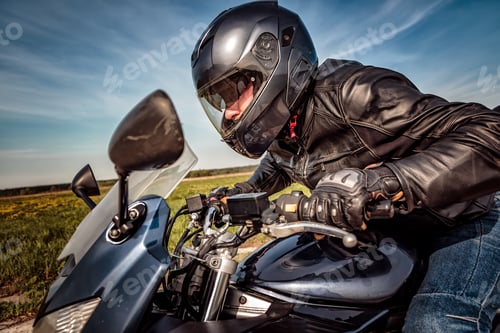 Preview: Biker racing on the road