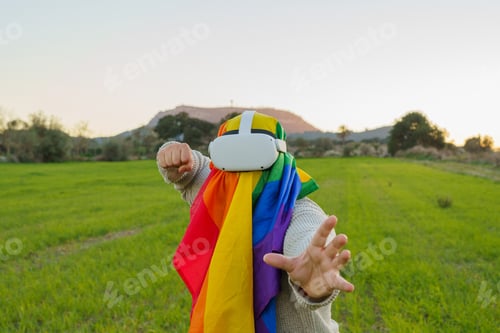 Preview: Man with virtual reality glasses and LGBT flag sticking in the air